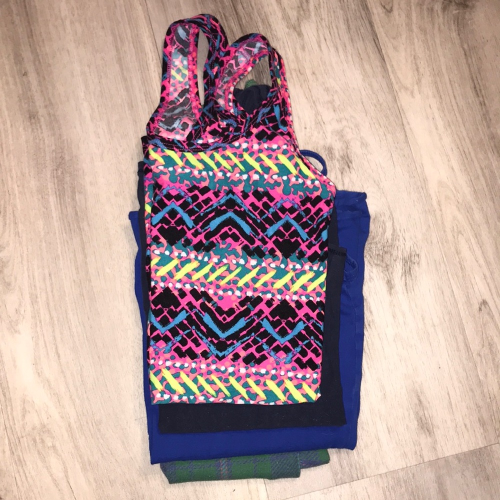 An assortment of tank tops size small. All used but in good to okay condition.